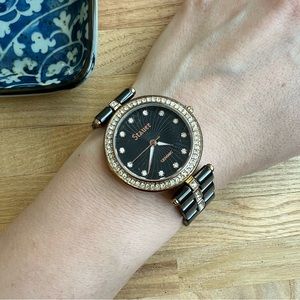 Stauer ladies ceramic black dial and gold tone dress Watch NEW BATTERY